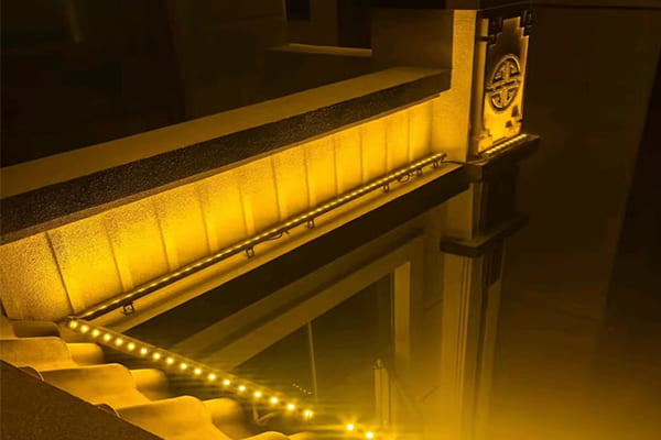 Close-up of a non-invasive lighting fixture on a historic wall